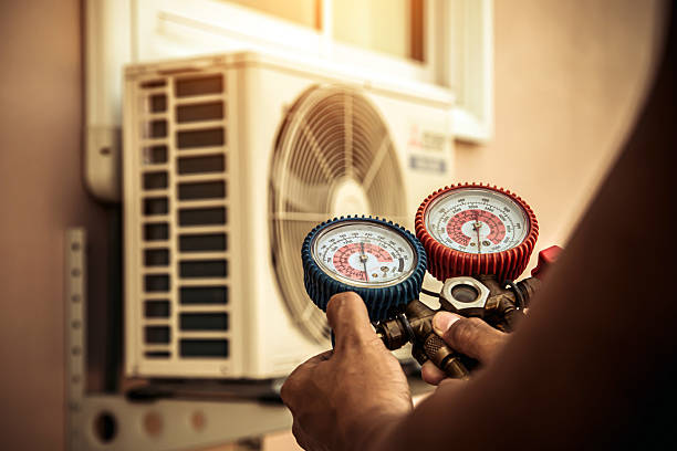 Professional Heat Pump Repair technician working in Oakville, IN